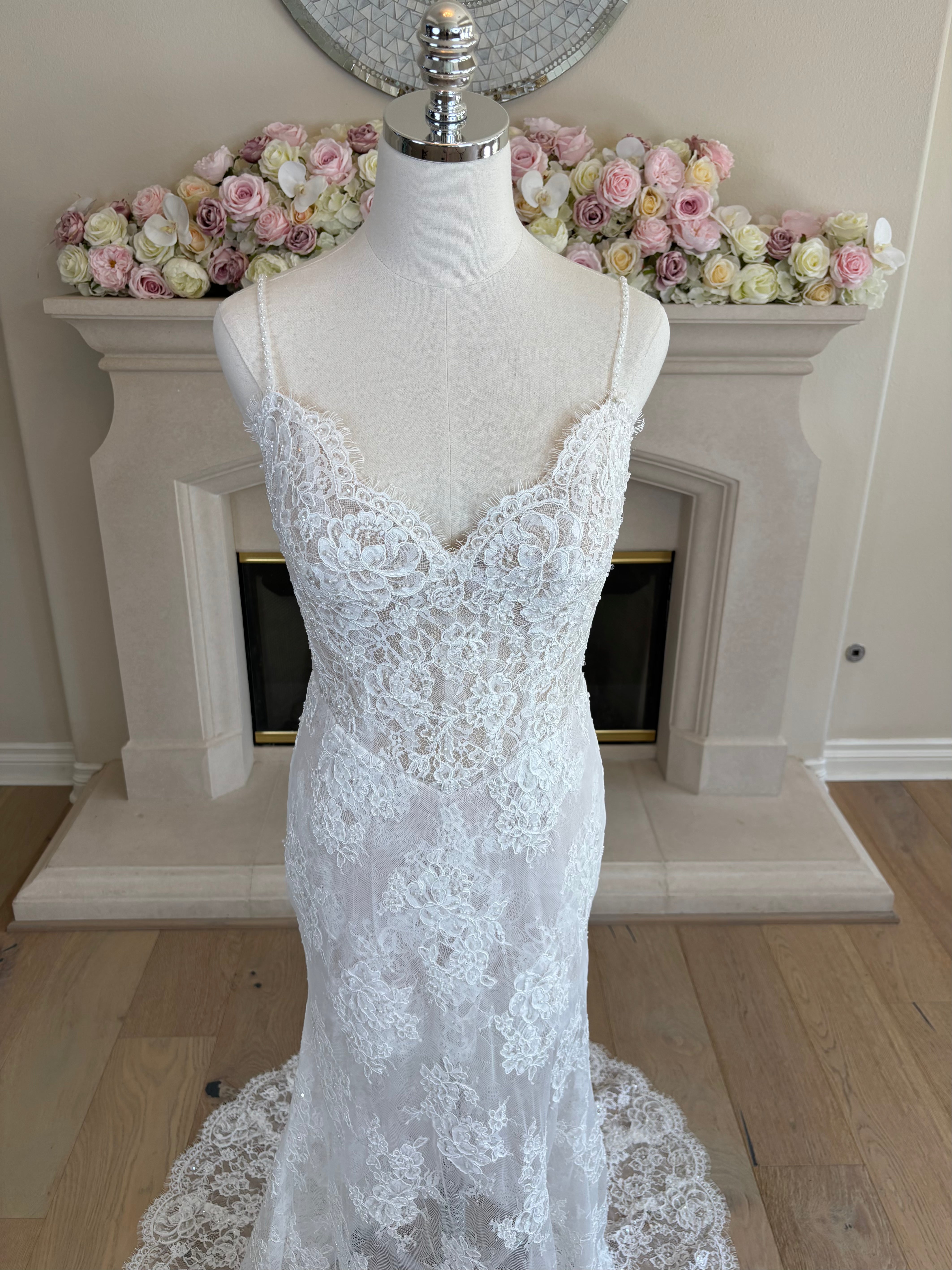 Close-up of the bodice of Amélie sheer floral french lace wedding dress