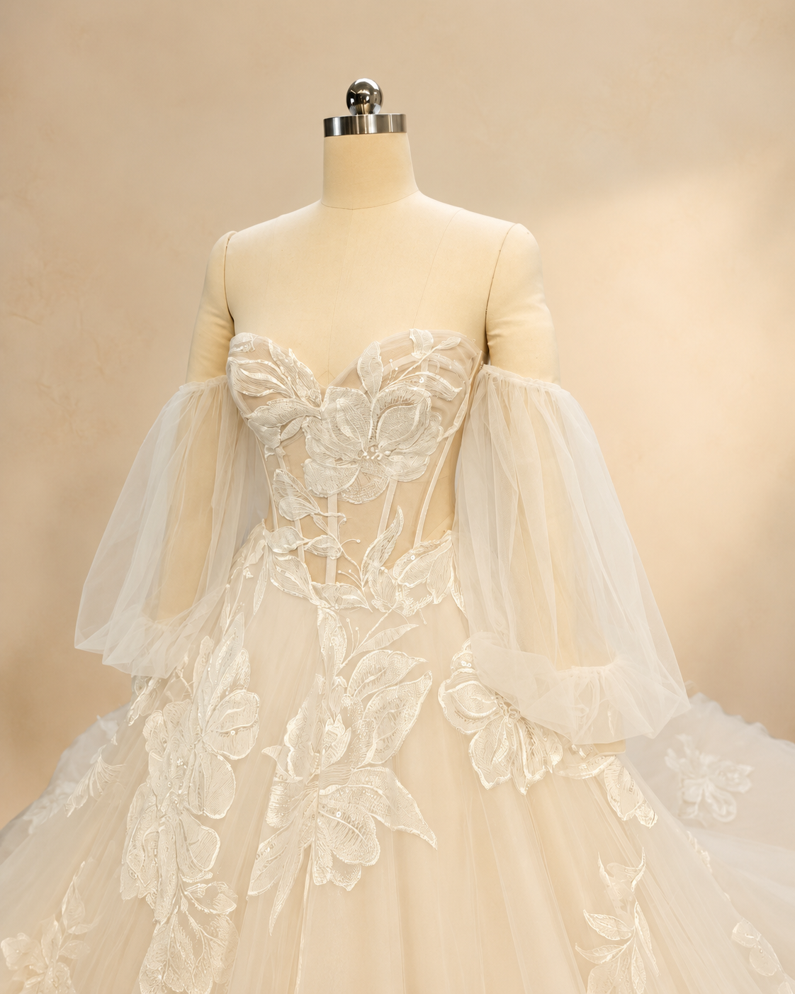 Close-up of Florienne sweetheart illusion corset bodice with exposed boning and oversized embroidered floral appliqué
