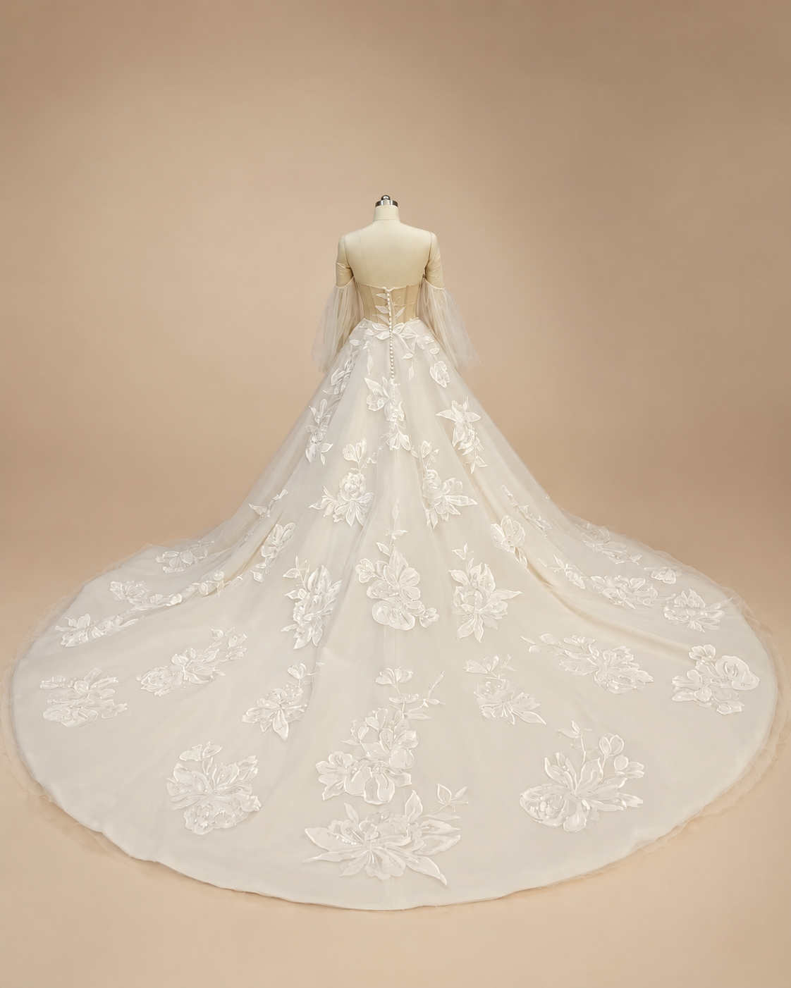 Back view of Florienne off-white floral embroidered A-line wedding dress with chapel train