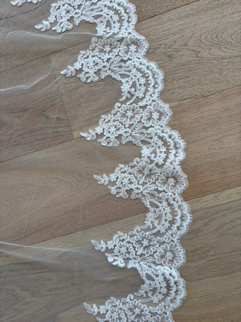 Close up of the Embroidered Corded Lace border of Paloma mantilla cathedral wedding veil