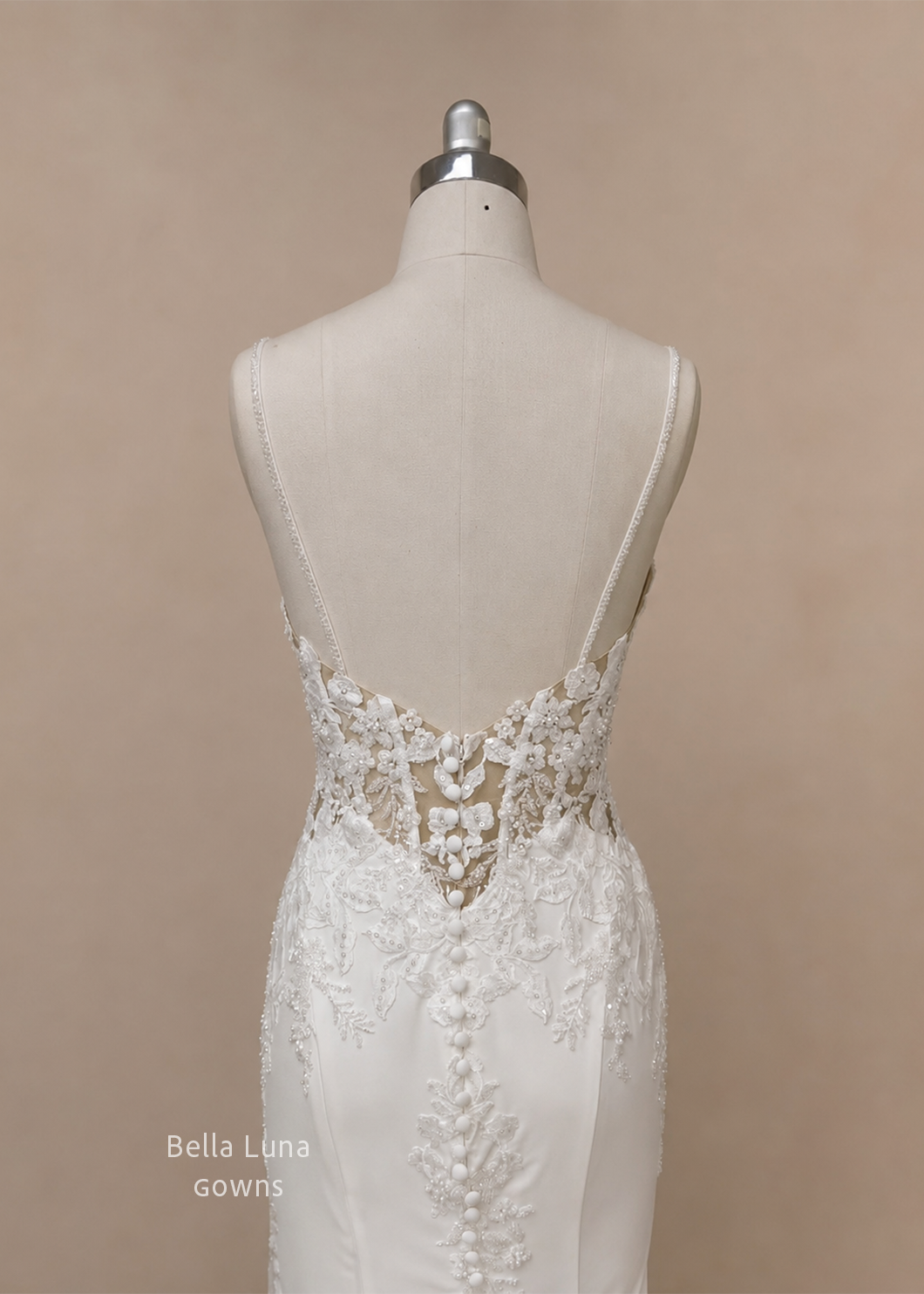 Close-up of Avelisse beaded floral lace illusion back and bridal button closure