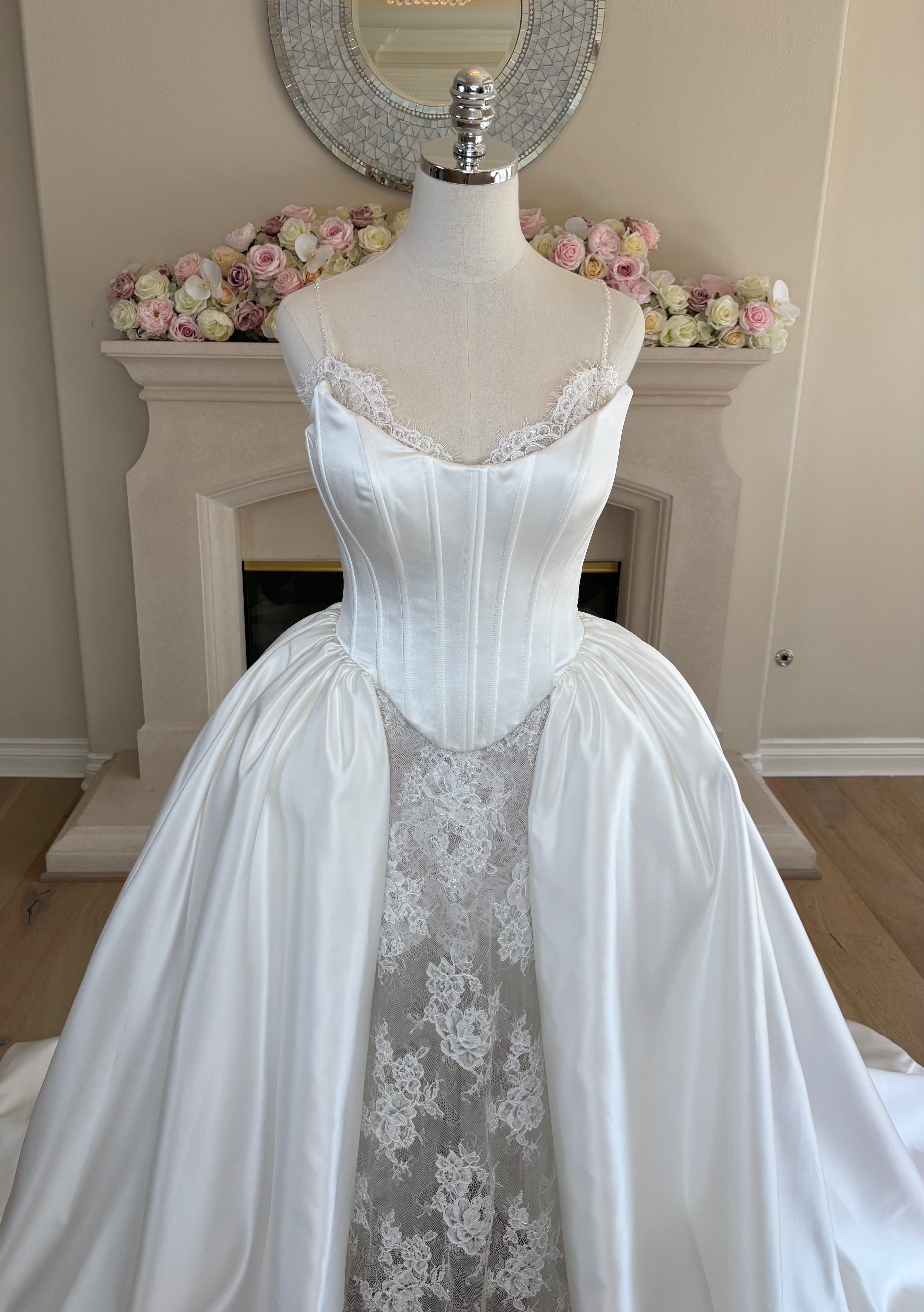 Close-up of Amélie hand-beaded floral lace bodice with sweetheart neckline and beaded spaghetti straps with Mikado corset with overskirt