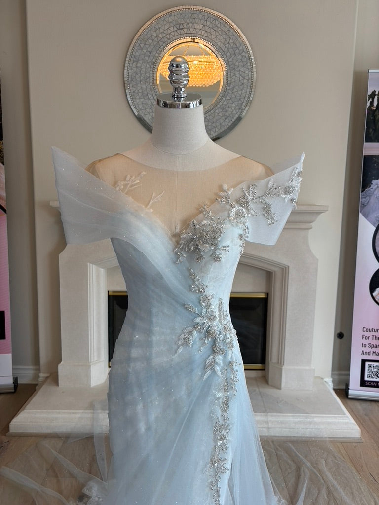 Ondine illusion neckline with sculptural tulle cap sleeves and shoulder draping