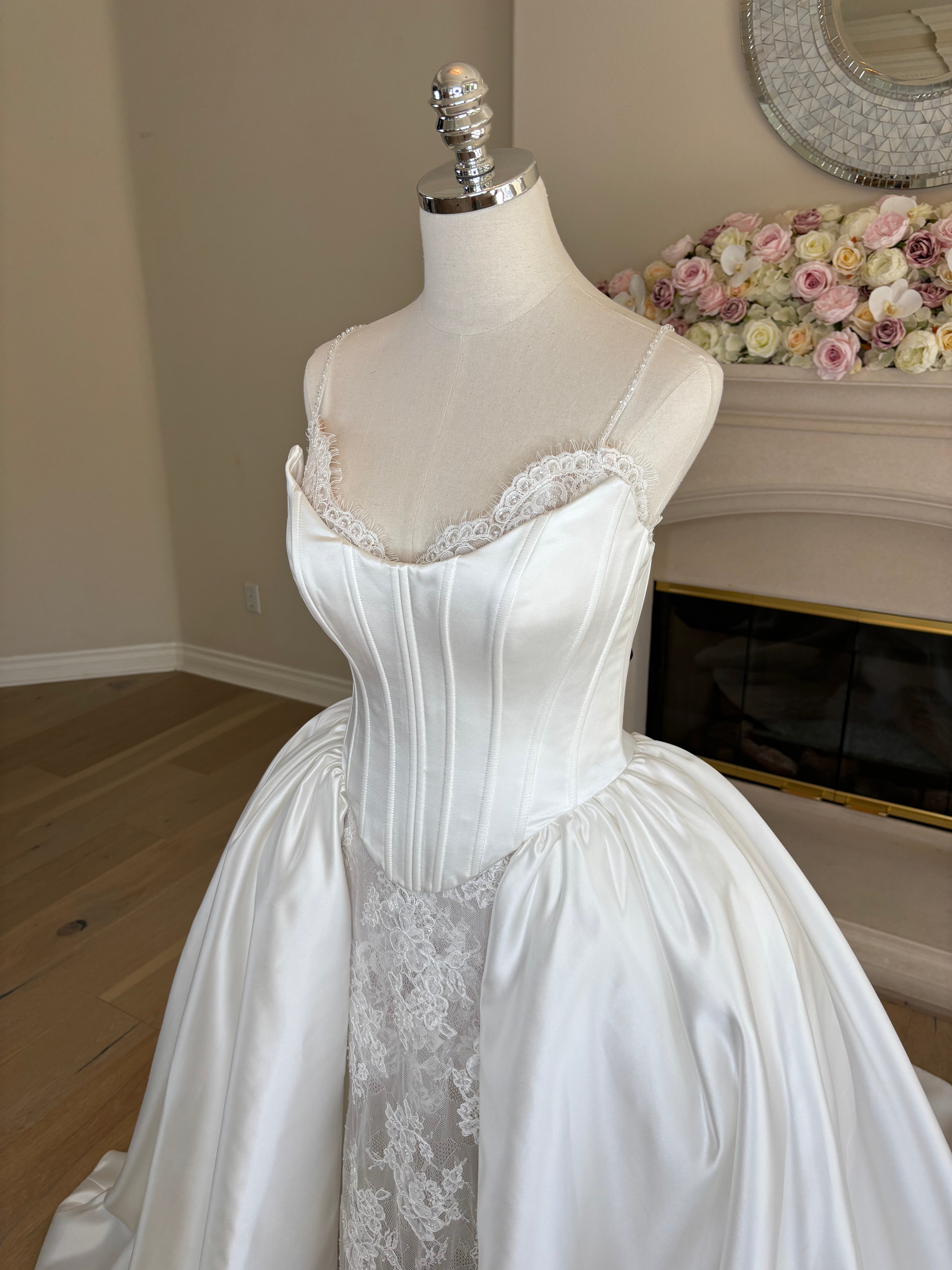 three quarter side view of Amélie convertible French lace wedding dress with detachable Mikado corset overskirt, full front view