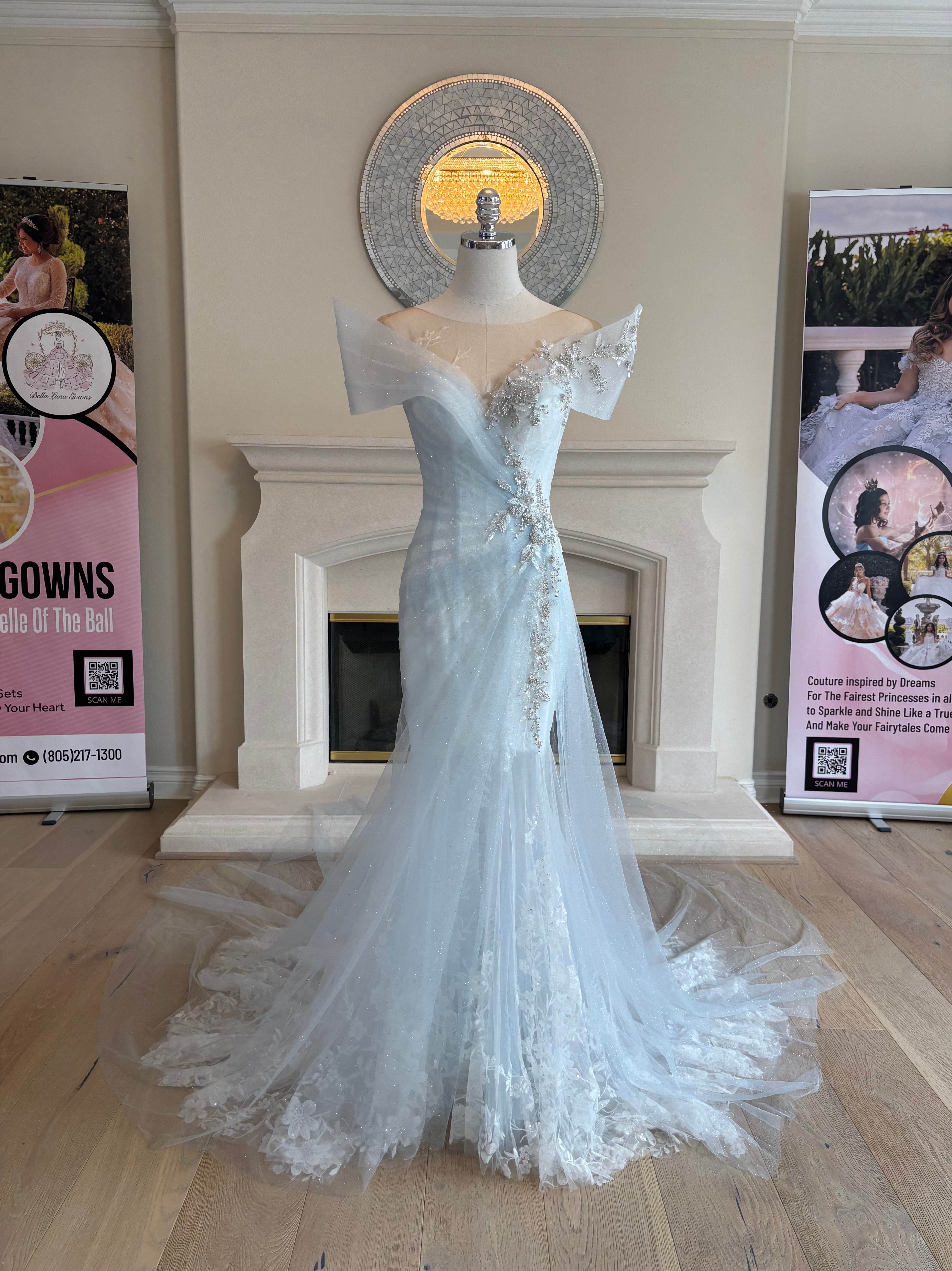 Front view of Ondine light blue wedding gown with white floral lace