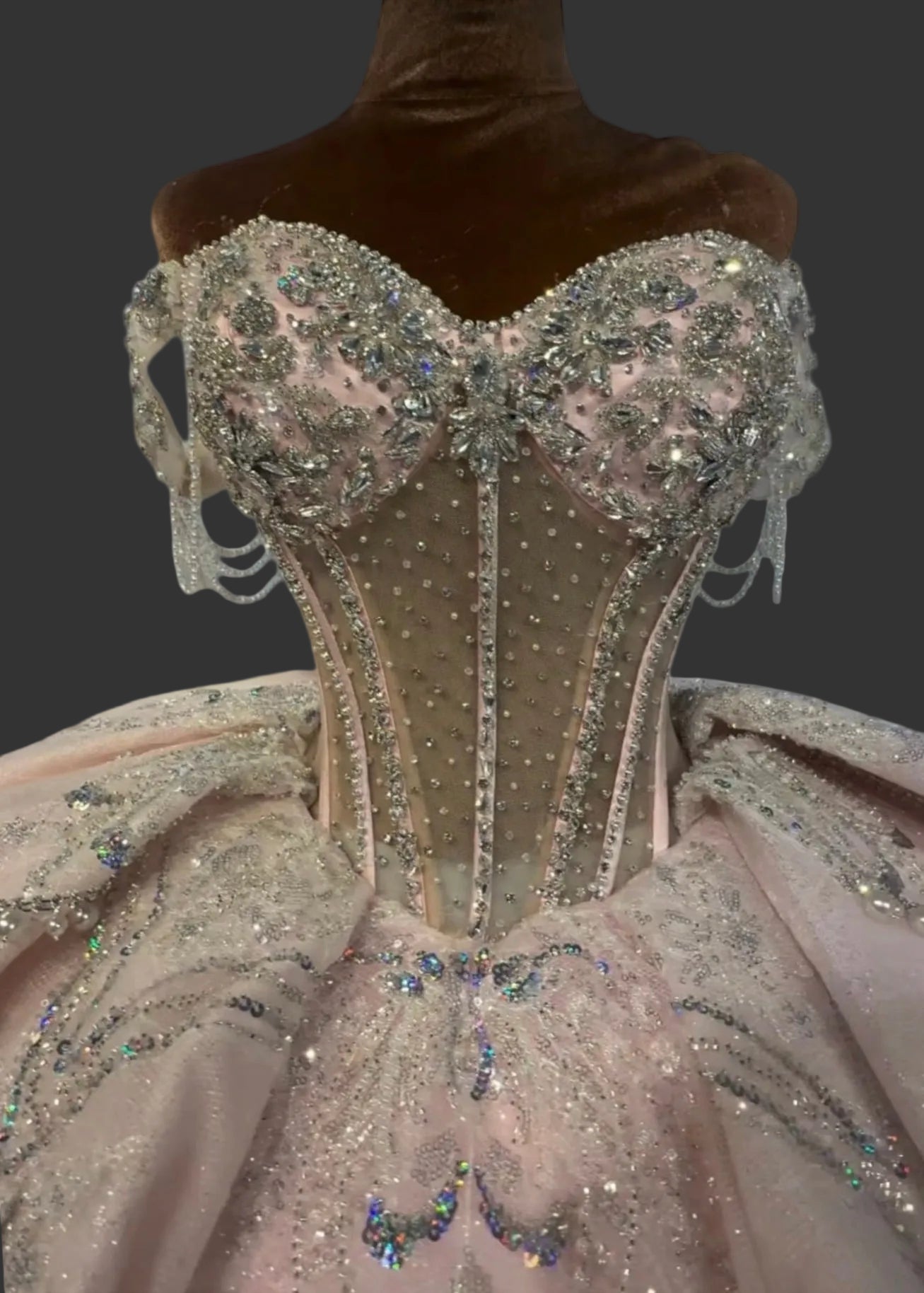Amorette pink quinceañera dress with rhinestone sweetheart bodice and exposed corset boning