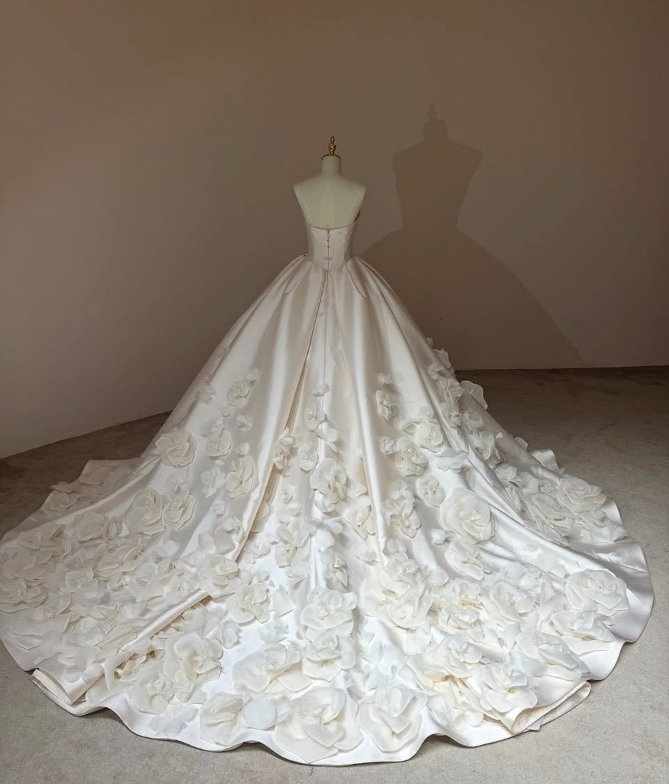 Back view of Camellia Royale premium Mikado satin wedding gown with zipper closure and a floral cathedral train.