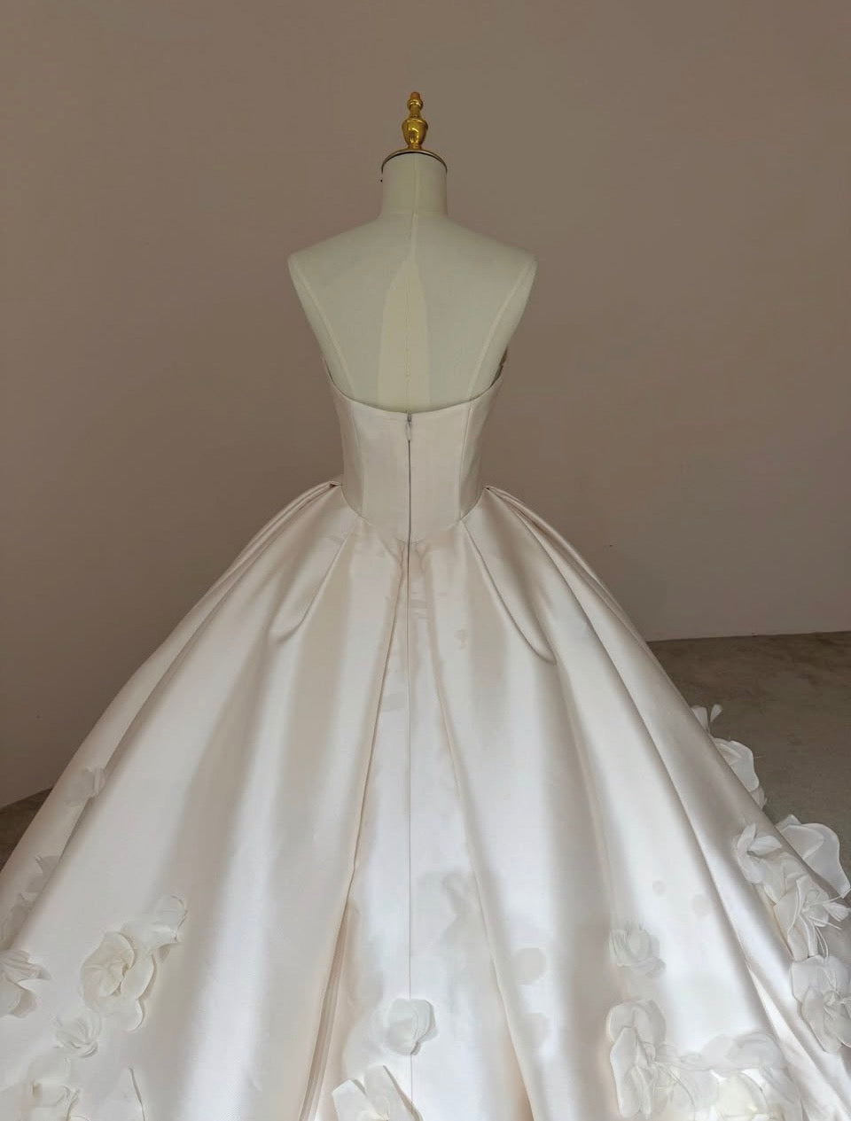Back view of Camellia Royale premium Mikado satin wedding gown with zipper closure.