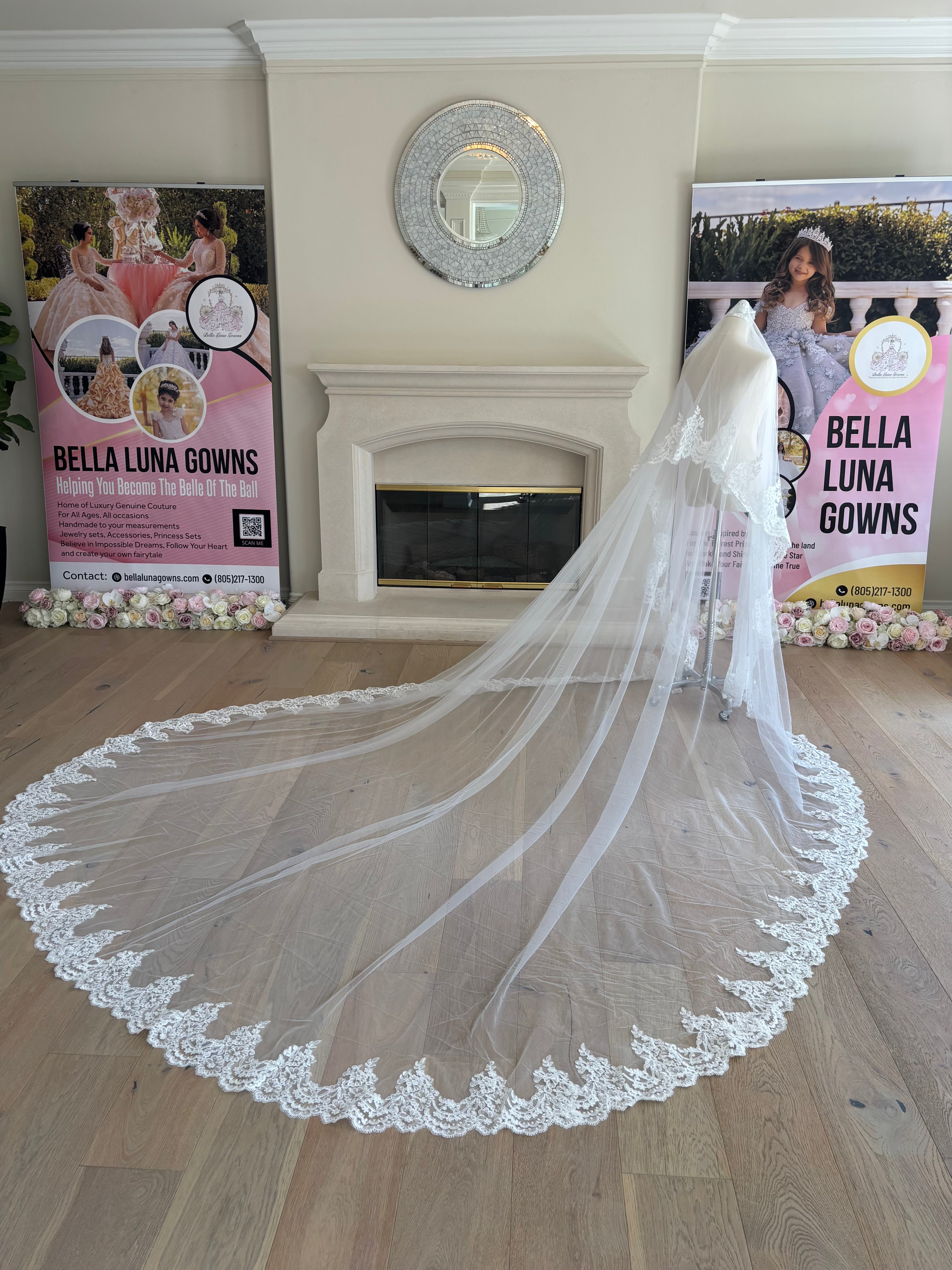 Side view of Paloma mantilla cathedral wedding veil with a bridal blusher, sheer tulle construction and an elaborate embroidered corded lace border.