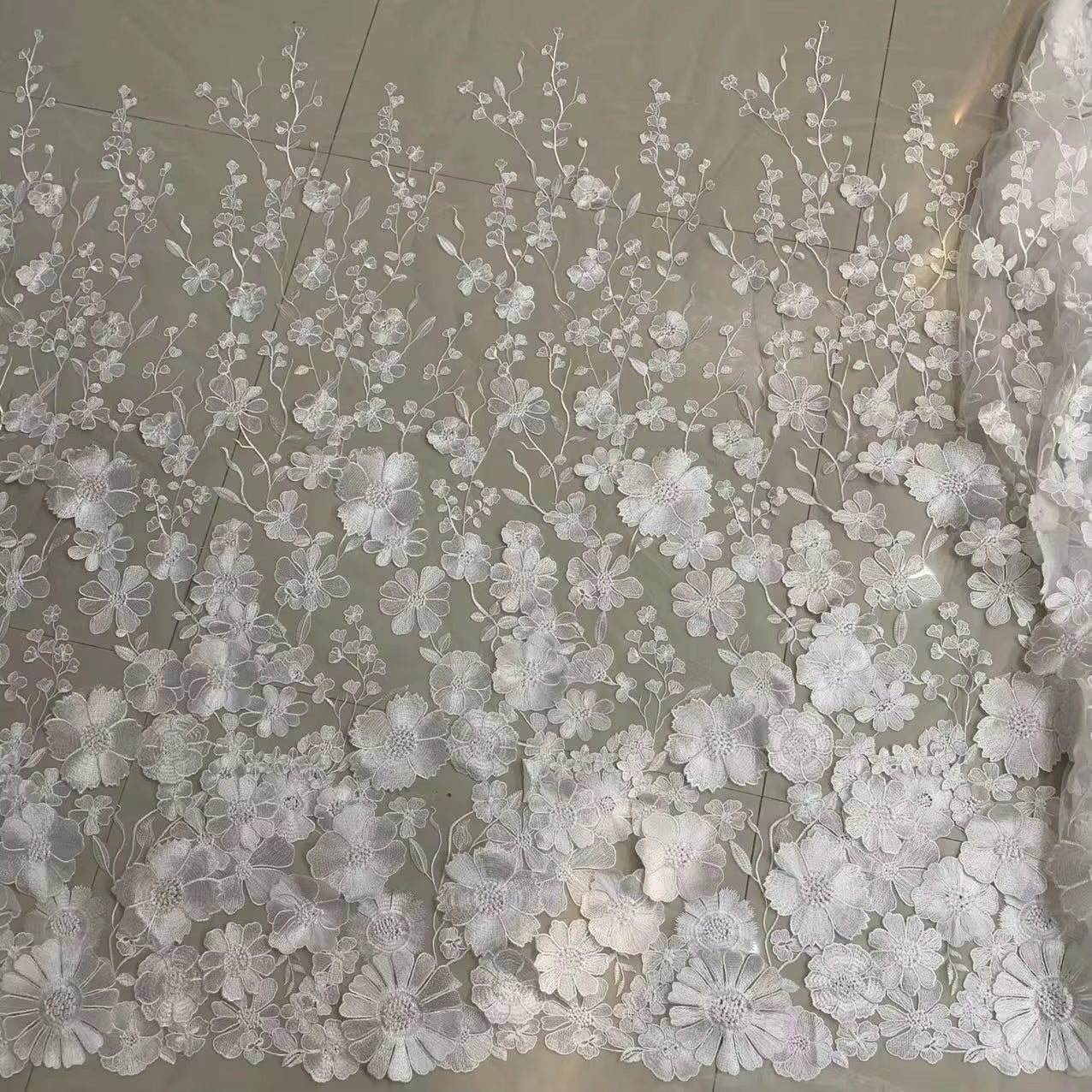 Close up view of the embroidered floral lace used to create Seraphina Meadow