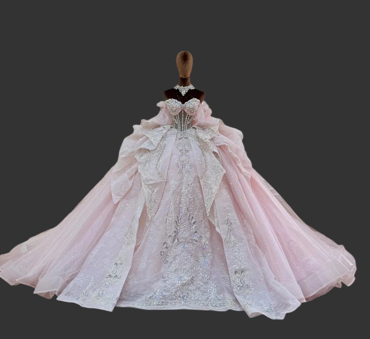 Amorette blush pink quinceañera ball gown with rhinestone corset bodice and silver beaded lace