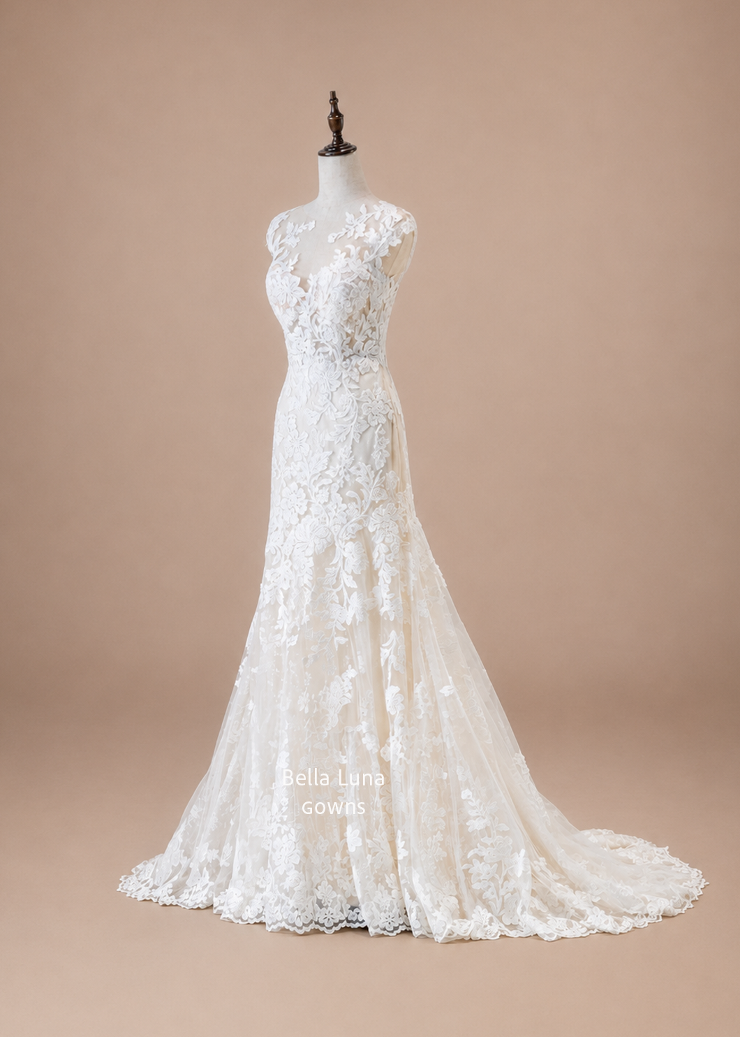 angled front view of Léontine beaded lace fit-and-flare wedding dress with illusion bateau neckline and cap sleeves