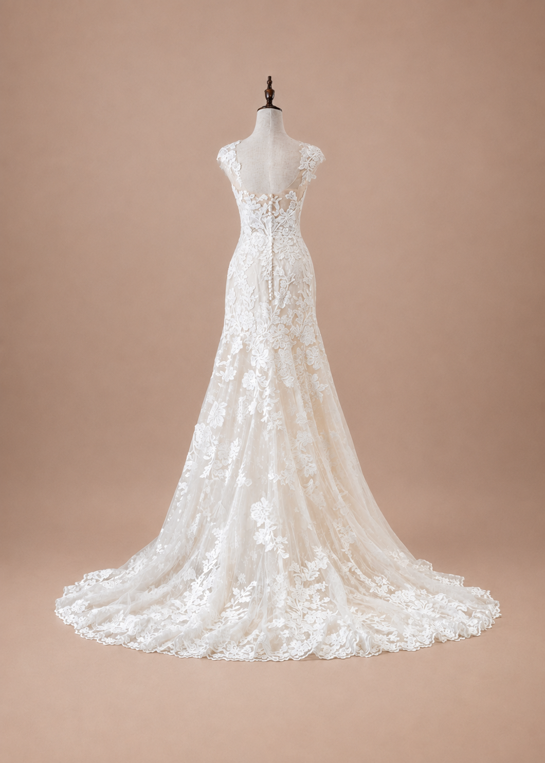 Back of Léontine lace wedding dress with low illusion back, bridal buttons and court train