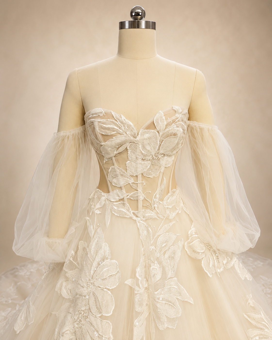 Close-up of Florienne sweetheart illusion corset bodice with exposed boning and oversized embroidered sequin beaded floral appliqué
