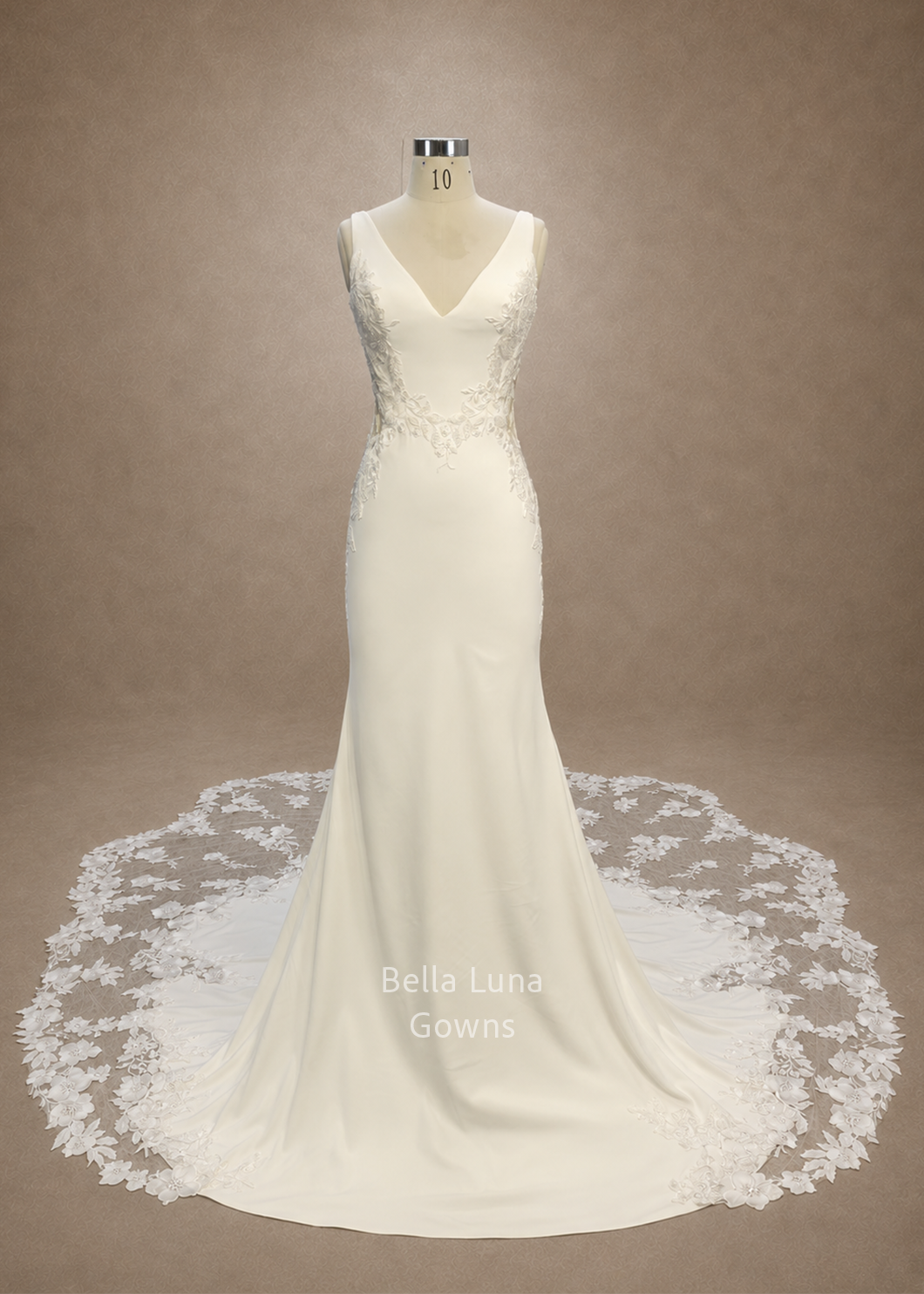 valessine-real-gown-front-satin-trumpet-wedding-dress.webp
Alt: Front view of the real Valessine satin trumpet wedding gown with floral appliqué and illusion train