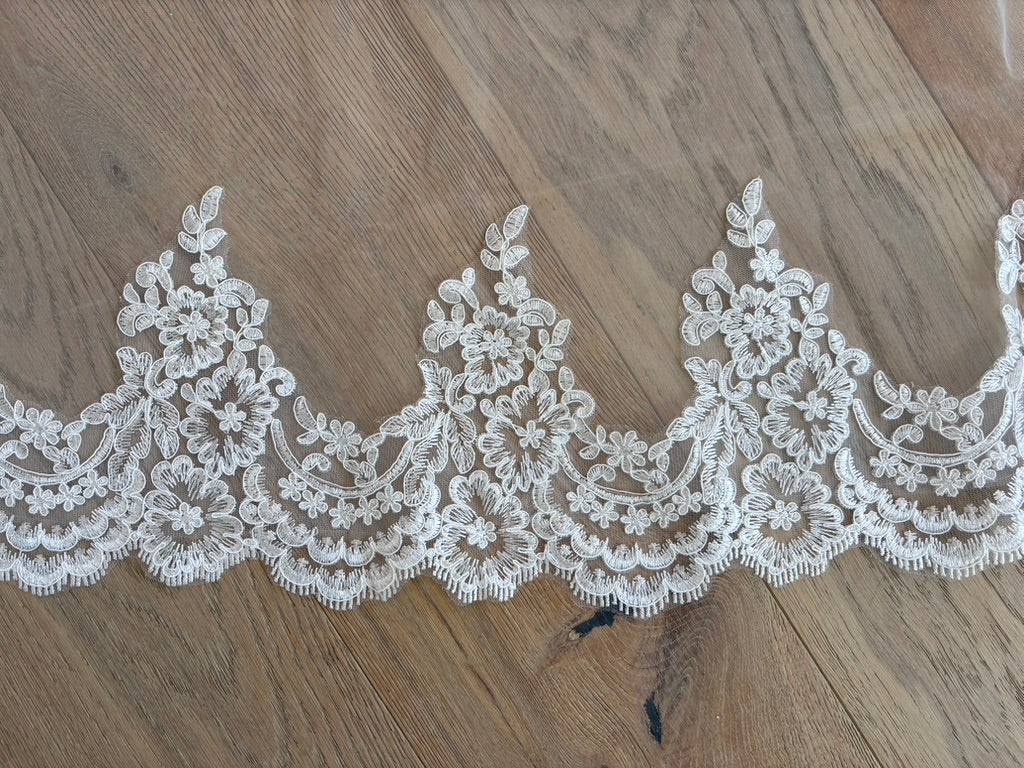 Close up of the Embroidered Corded Lace border of Paloma mantilla cathedral wedding veil 