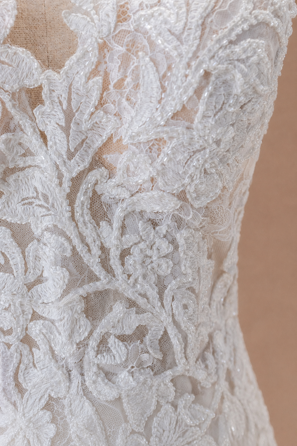 Close-up of Léontine beaded embroidered floral lace appliqué in Vintage color