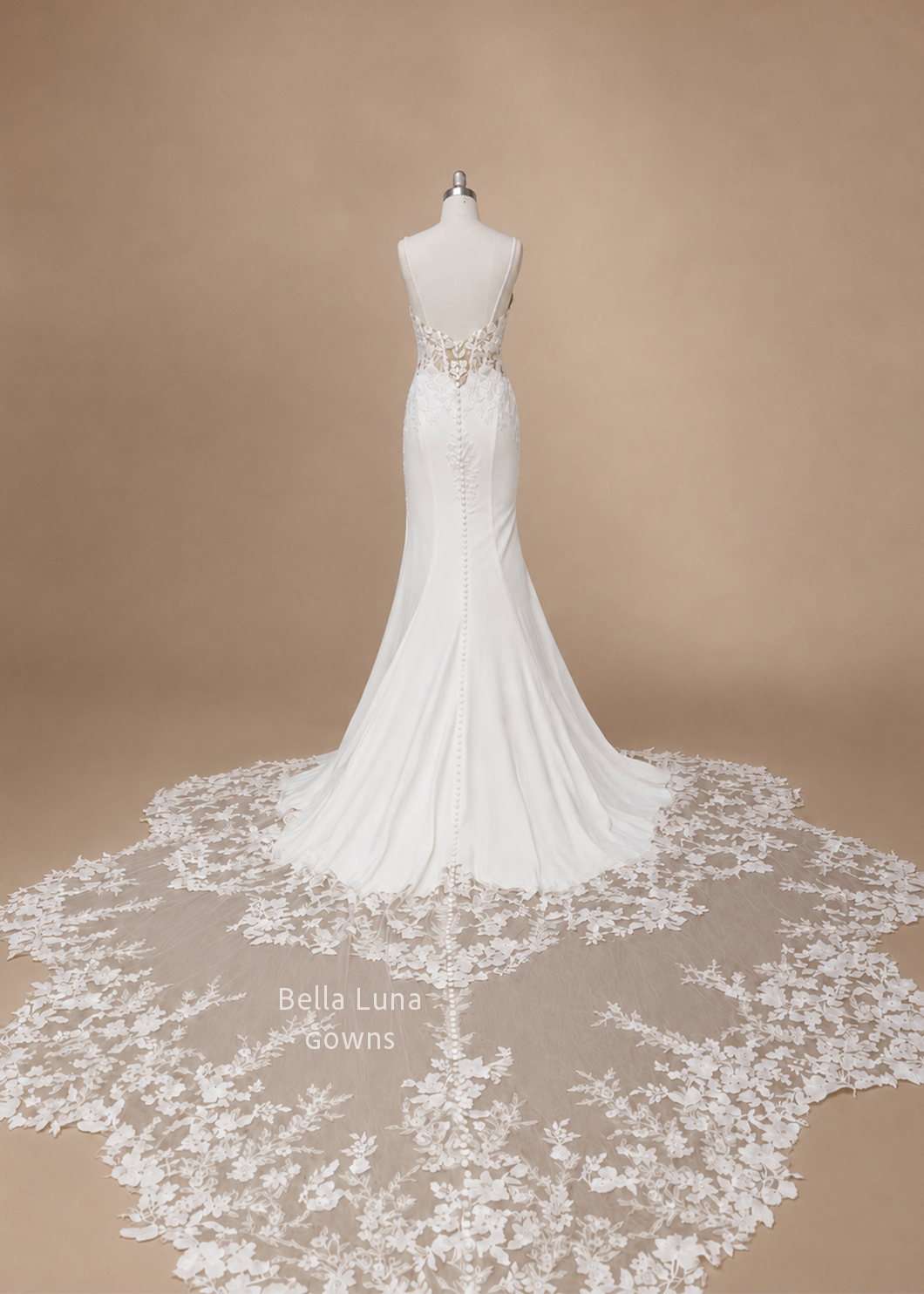 Full back view of Avelisse satin fit-and-flare wedding gown with long floral lace train