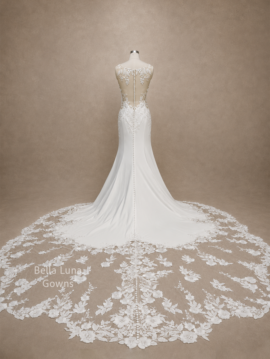 valessine-real-gown-floral-cathedral-train-back.webp
Alt: Full back view of the real Valessine wedding gown showing its embroidered floral cathedral-length train