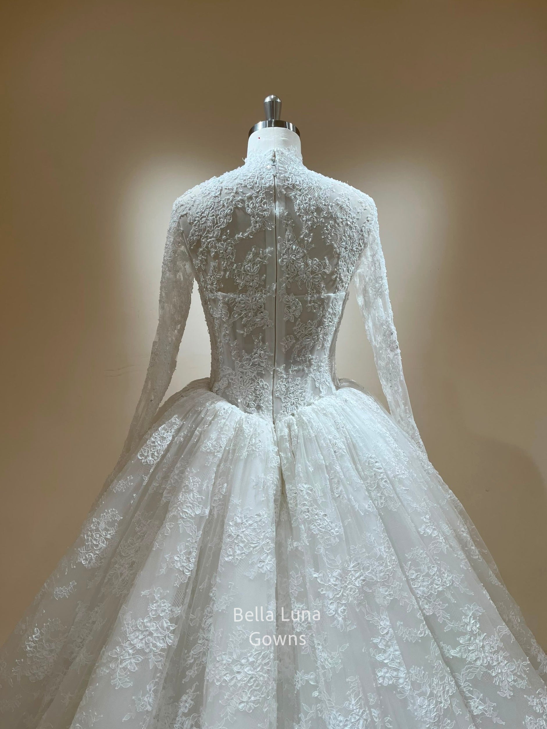 Close-up back view of the Theodora sheer lace bodice with zipper closure, long sleeves and basque waist