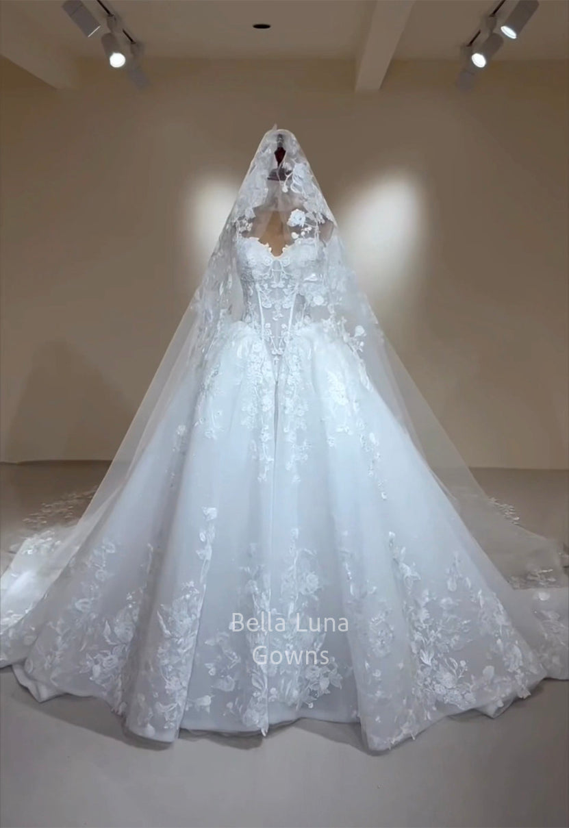 Arabella Shimmer lace bridal ball gown front view on mannequin with sheer corset bodice and full tulle skirt styled with matching veil