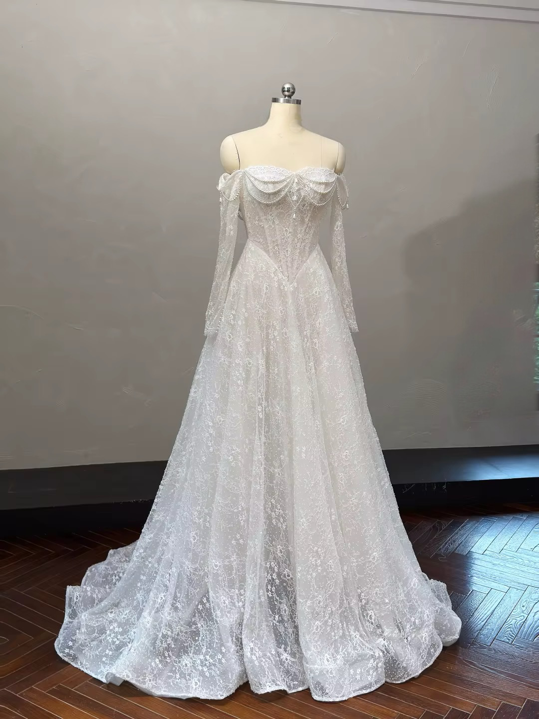 Full-length Marielle pearl lace bridal gown with sweetheart neckline, basque waist and soft A-line silhouette