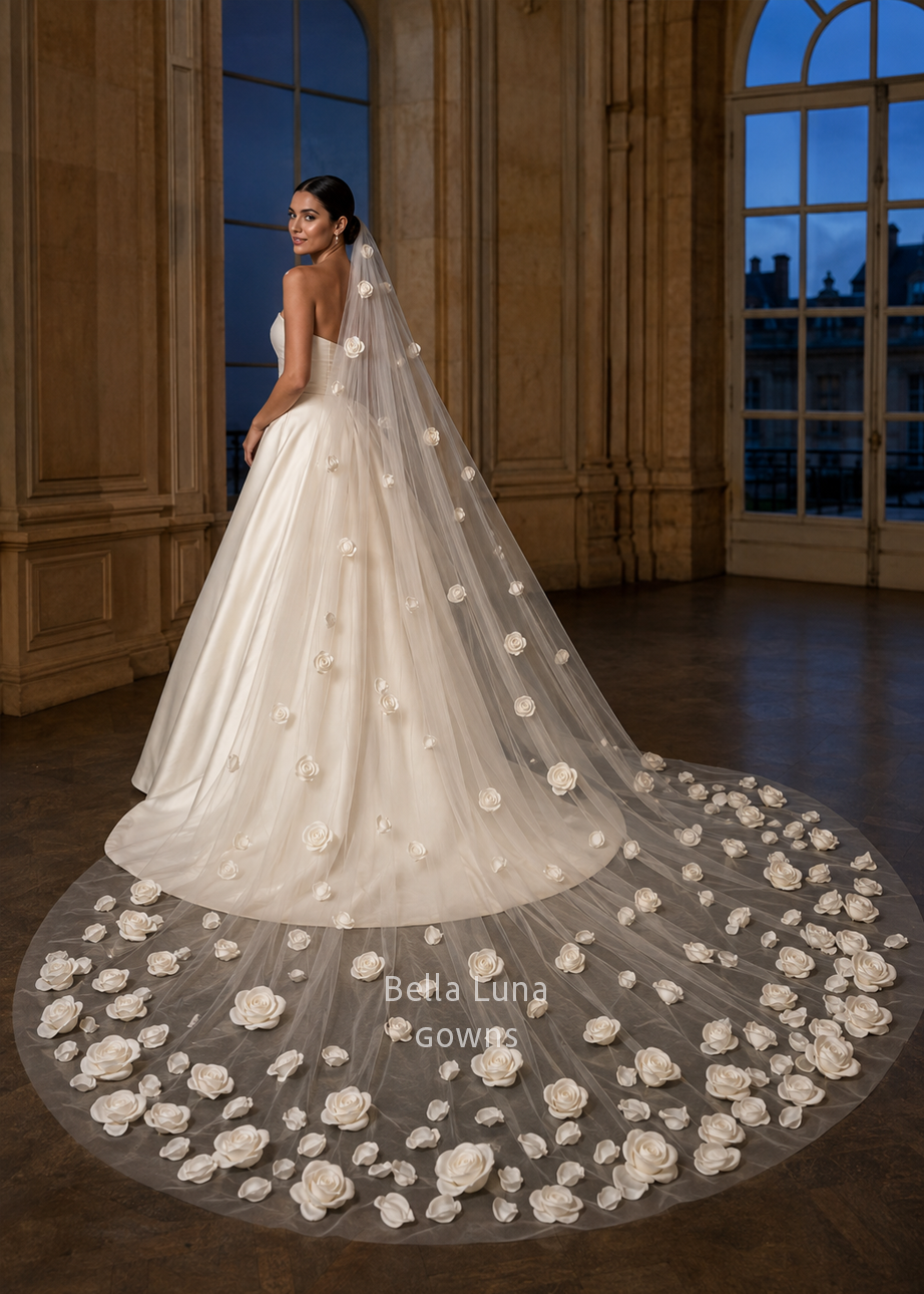 Custom 3D floral wedding veil designed to coordinate with a satin ball gown covered in handmade flowers.