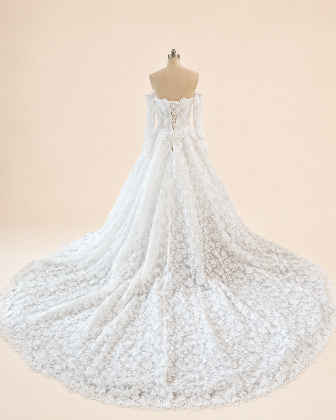 Rear view of Estelle corded French lace wedding gown showing lace-up corset back and sweeping chapel-length train