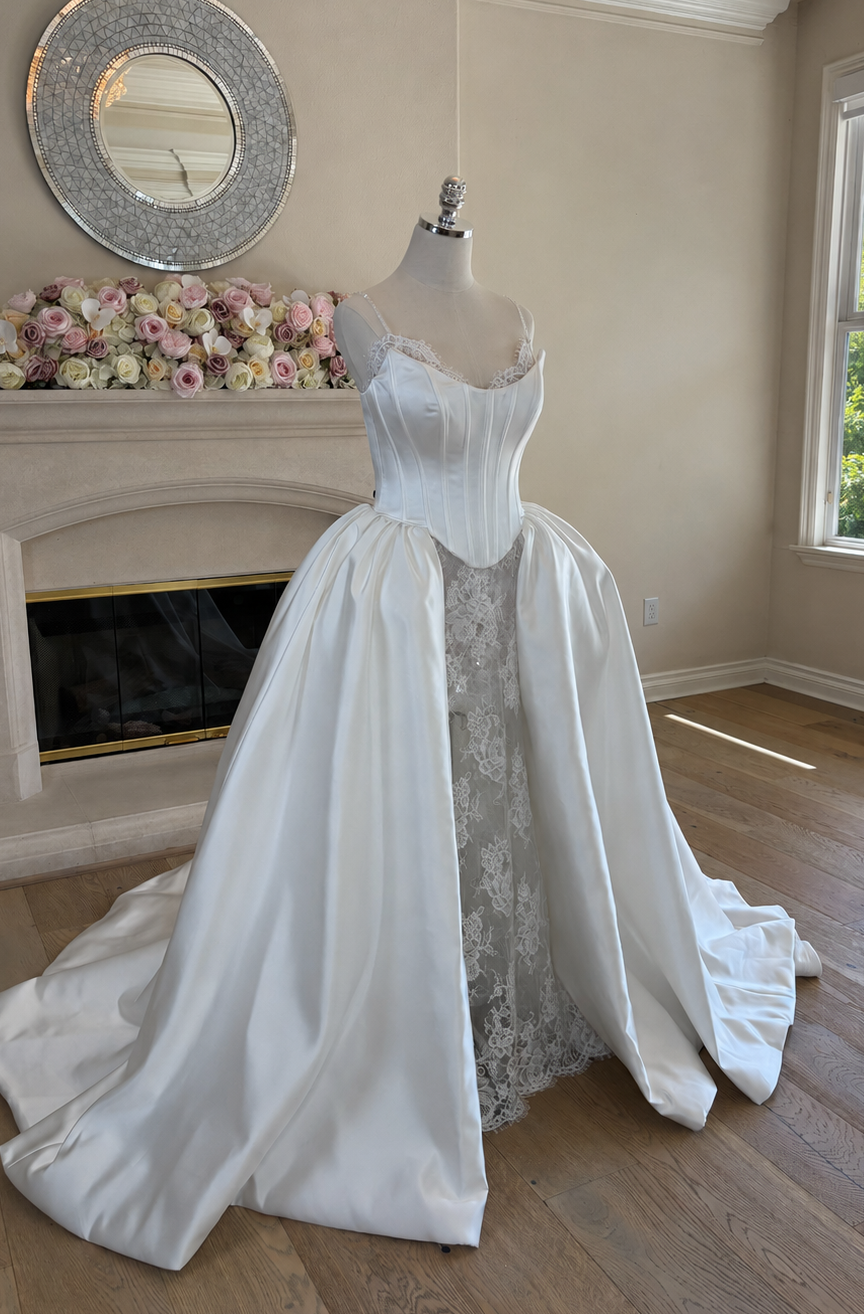 three quarter front view of Amélie two-piece wedding gown worn with structured Mikado corset overskirt in an A-line silhouette